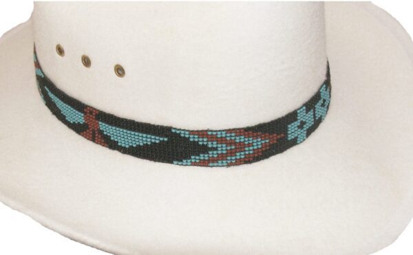 A white cowboy hat with a Turquoise Firebird Hand Beaded Horse Hair Tassel Hat Band.