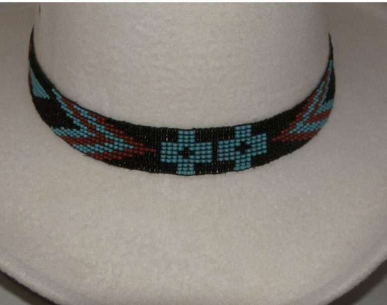 A Turquoise Firebird Hand Beaded Horse Hair Tassel Hat Band with a hat on it.