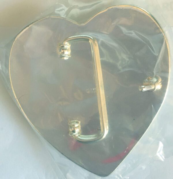 A Sterling Silver Gold Plated Western Heart Belt Buckle shaped box with a handle on it.