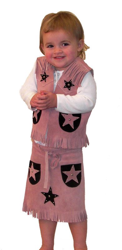 A little girl wearing the "Calamity Pink" Girls suede skirt and vest set outfit.