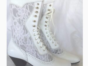 A pair of "Cathedral" Women's White Leather Lace Up Frontier Wedding Boots.