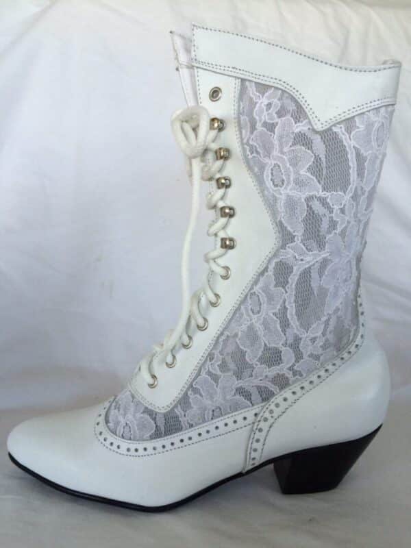 A pair of "Cathedral" Women's White Leather Lace Up Frontier Wedding Boots on a white background.