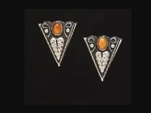 A pair of German Silver Tiger Eye Collar Tips with orange stones.