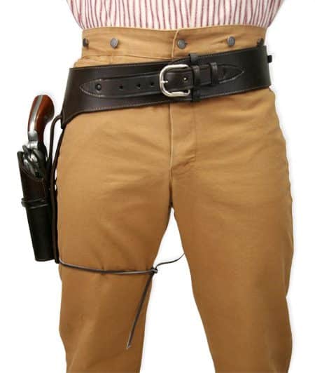 A man wearing a .45 Caliber Antique Brown Leather Single Western Gun Holster and tan pants.