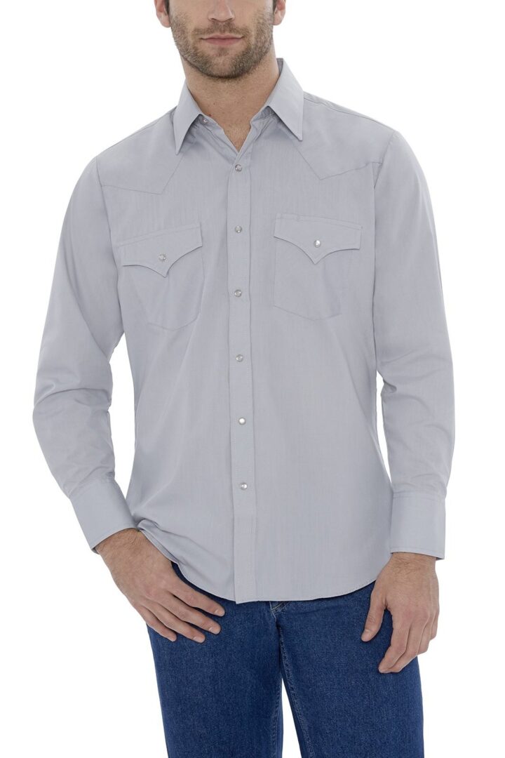 A man wearing a Mens Pearl snap Gray western shirt and jeans.