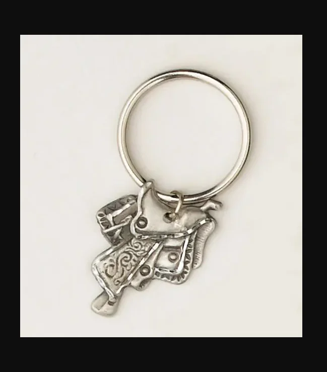 A Sterling Silver Gold boots western key chain with a horse on it.