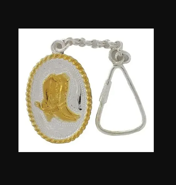 A Sterling Silver Gold boots western key chain with a cowboy boot on it.