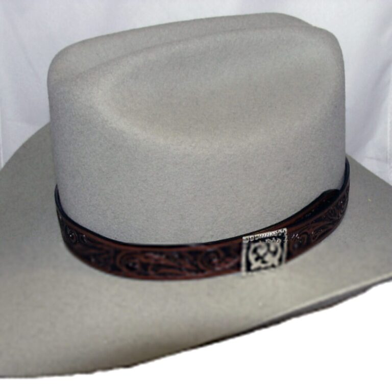 A light colored hat with a brown engraved band