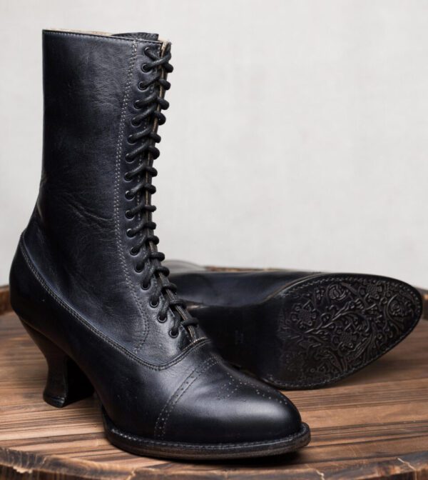 Mirabelle Black Leather Womens Granny Boots on a wooden table.