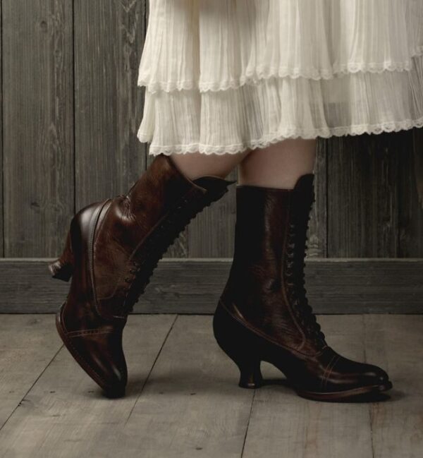 A woman wearing a white dress and brown boots, including Mirabelle Teak Leather Womens Granny Boots.