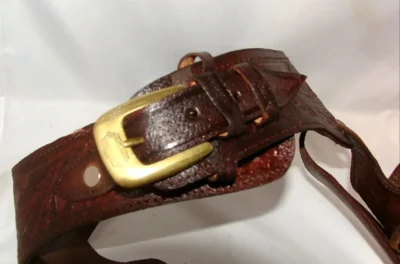 Kids Single gun tooled leather holster <ul> <li><span style="color: #000000;">100% LEATHER</span></li> <li>REAL HOLSTER</li> <li>16"-30" WAIST</li> <li>Cherry or Black</li> </ul> •