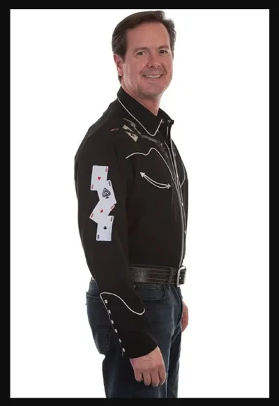 A man wearing a "Ghost Shootin Aces" Mens Scully Black Embroidered Western Shirt and playing cards.