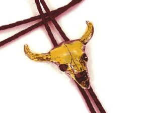 Gold Longhorn Skull Bolo Tie on white background