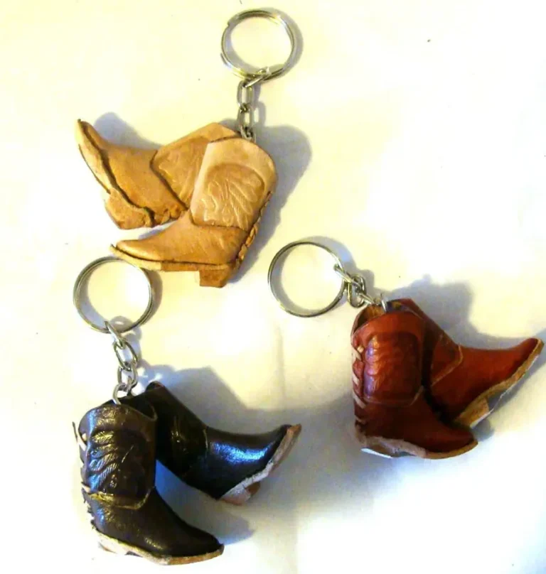 A pair of leather double mini cowboy boots keychain.