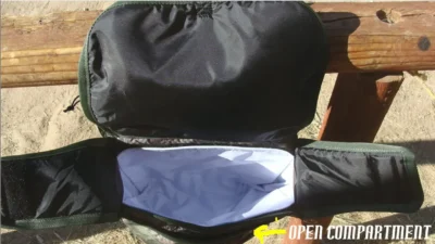 The inside of a backpack with a zippered compartment designed for Deluxe Horse Saddle bags with bottle holders, insulated side.