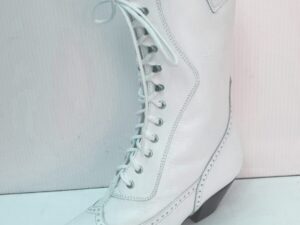 A pair of Steeple Womens 6 white leather granny wedding boots with laces.