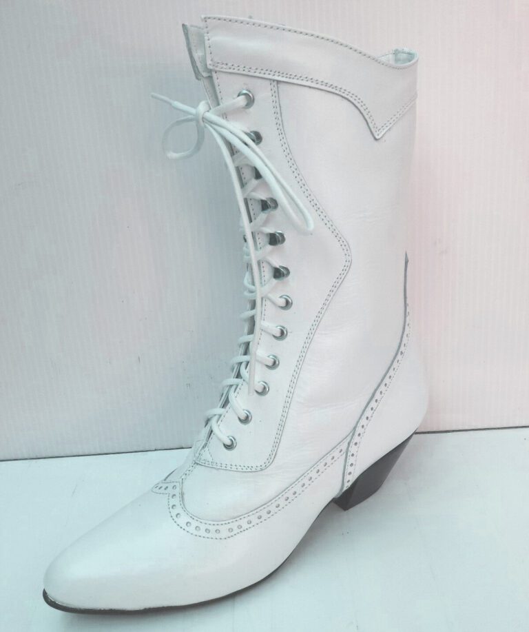 A pair of Steeple Womens 6 white leather granny wedding boots with laces.