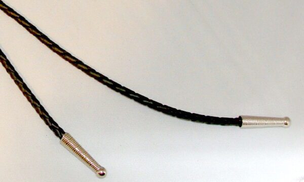 A pair of black braided cords on a white surface.