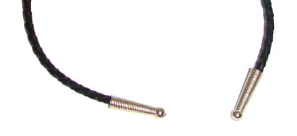 A black leather cord with two metal pins on it.