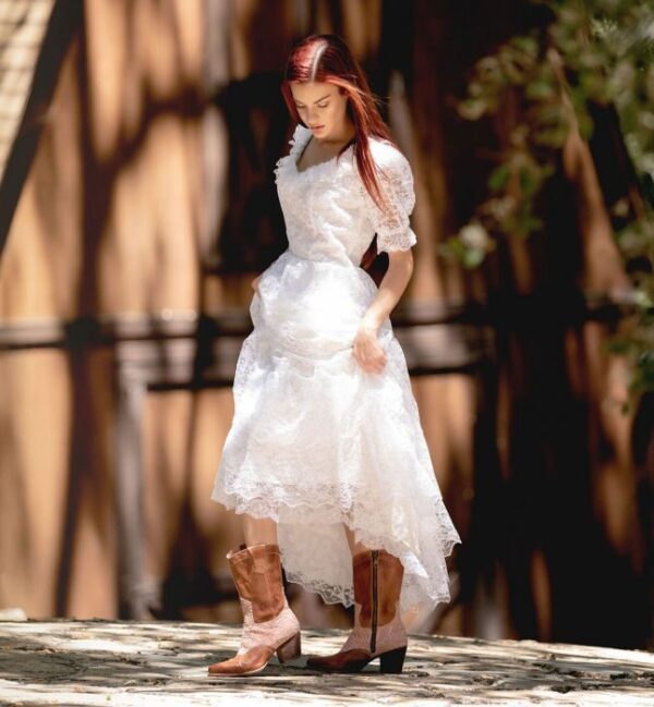 A woman in a white wedding dress and Basanti Side Zipper Tan Leather Pink Lace Women's Granny Boots.