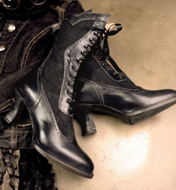 A pair of Abigale Black Rustic Leather & Lace Womens Granny Boots with a leather jacket.