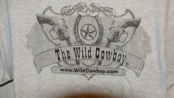 The "The Wild Cowboy" Logo Mens Ash short sleeve western T-shirt on a gray t - shirt.