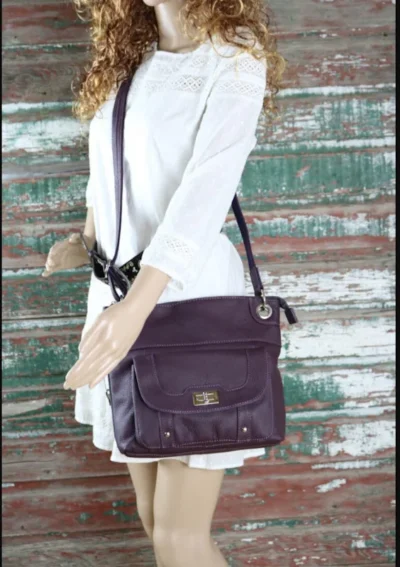 "JO" Women's Purple Leather Concealed Carry Purse with Holster <div> <ul> <li>100% Leather</li> <li>12" x 10"</li> <li><strong>WITH GUN HOLSTER </strong></li> <li>CONCEALED CARRY</li> </ul> </div> •