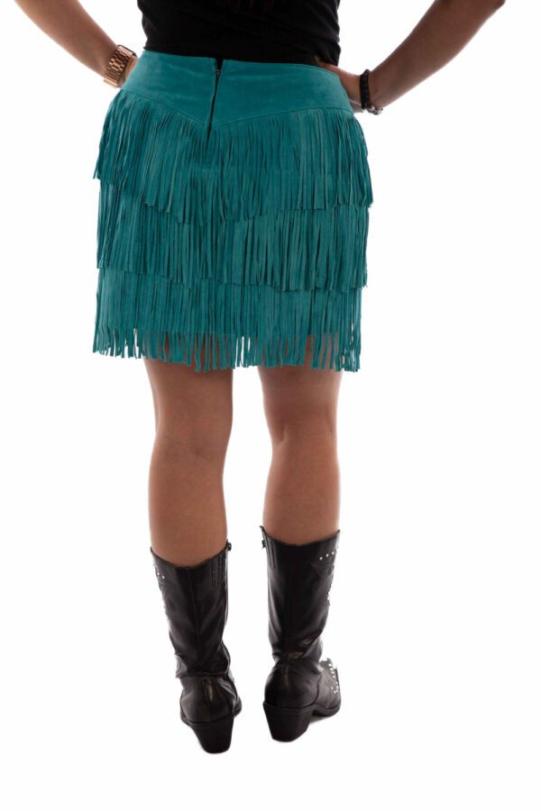 A woman wearing a Womens Turquoise Suede Full Fringe Short Western Skirt.