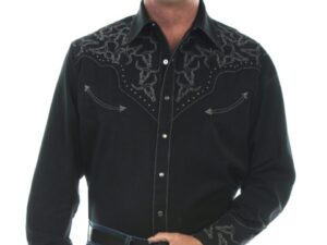 A man wearing a Steer Head Mens Scully Black Studded Western Shirt and jeans.