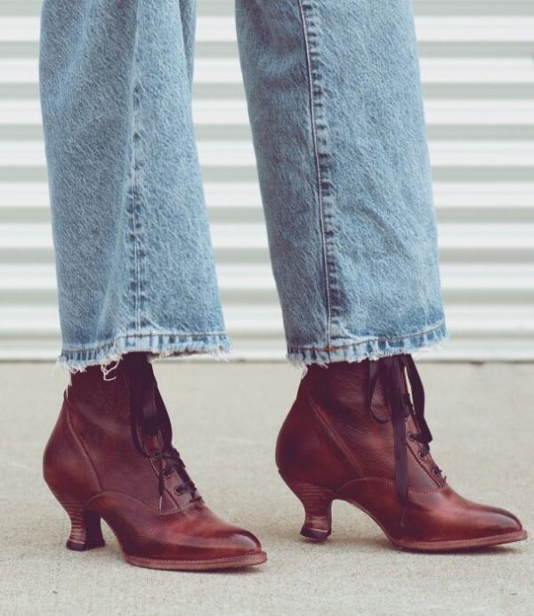 A woman wearing jeans and a pair of old brown Eleanor Merlot Wine Leather Womens Granny Boots.