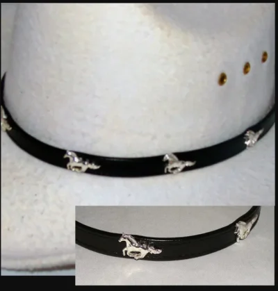 <div class="qsc-html-content"> "Mustang" Black leather cowboy hat band <ul style="list-style: square inside none;"> <li>Sliver plated</li> <li>Size: 3/8" wide</li> <li>Fits up to 26"</li> <li><span style="color: #0000ff;">MADE IN THE U.S.A</span></li> </ul> <strong>Condition:</strong> New Ships approximately 5-9 business days. </div> •