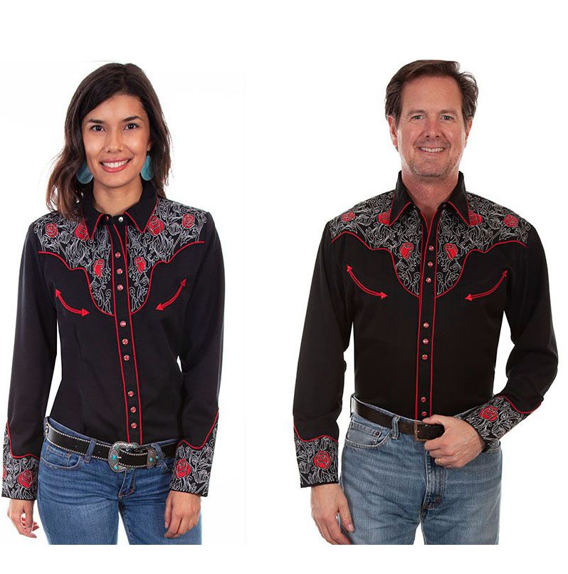 A man and woman wearing a black and red western shirt.