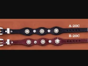 A Rhinestone Flower Western Leather Bracelet with studs on them.