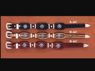 Four different styles of Rawhide Tooled Leather Western Rowel Bracelets are shown on a brown background.