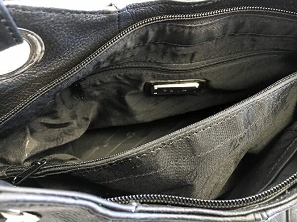The inside of a "Diane" Women's Black Leather Concealed Carry Handbag w/ Holster with zippers.