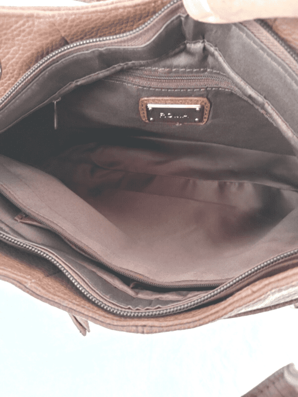 The inside of a "Diane" Women's Black Leather Concealed Carry Handbag w/ Holster.
