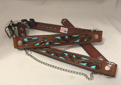 A brown and Turquoise & Black Tooled Leather Cowboy boot chains collar with a chain on it.