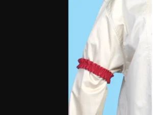 Red armband on a white sleeve.