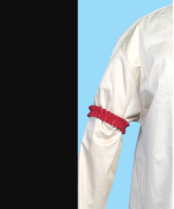 Red armband on white shirtsleeve.