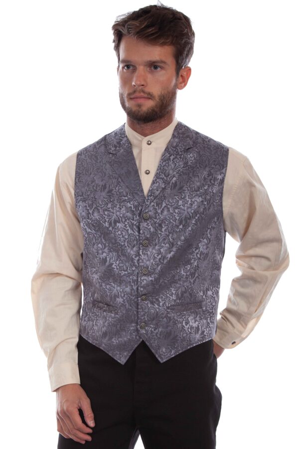 A man wearing a Men's USA Made Steel Blue Silk Lapel Western Vest and black shirt.