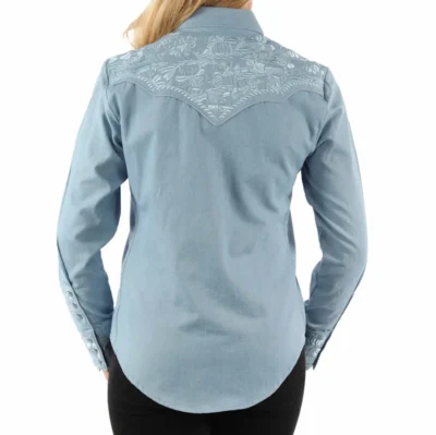 Scully Women’s Light Blue Western Shirt with floral raised embroidered details on front and back yoke and sleeve cuffs with matching pearl snaps.